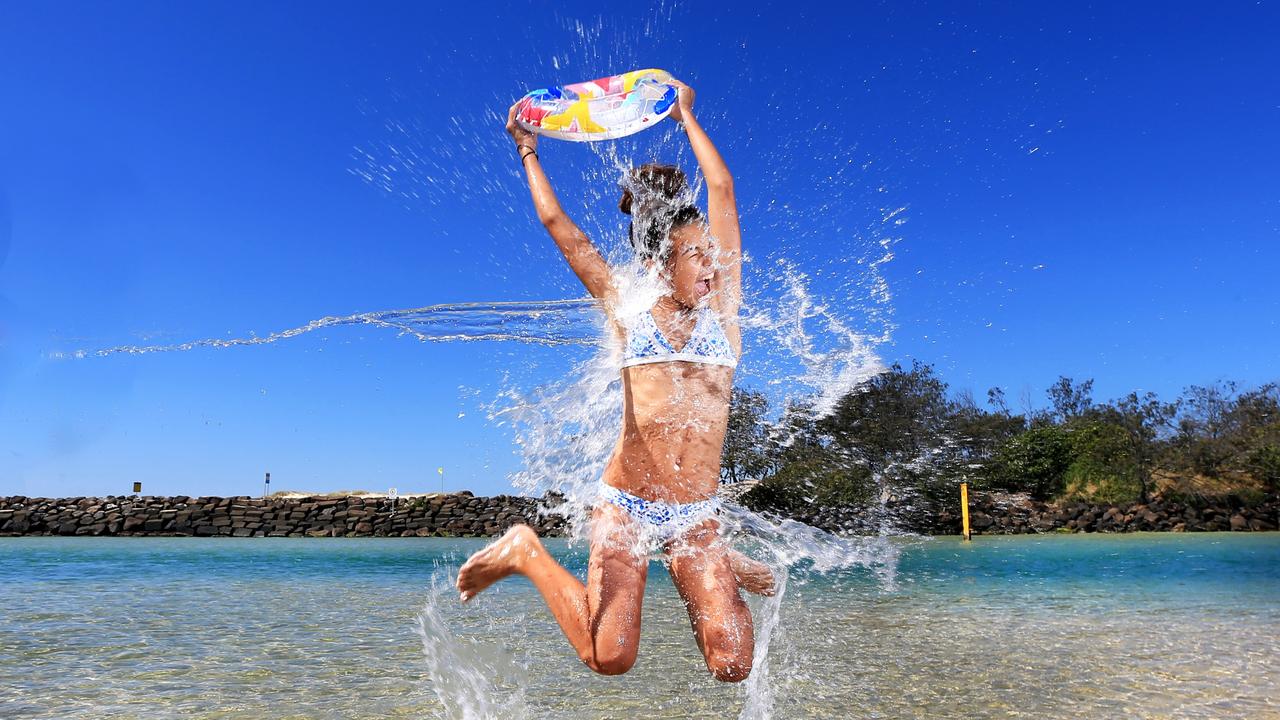 Amy Van den Akker enjoys a dip at Kingscliff during this weeks unseasonal hot winter weather on the Tweed Coast