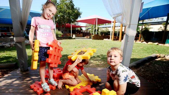 Gabrielle Payne, 5, Dimitri Badke, 5, Stirling Madsen, 4, enjoy child care. The price differences for childcare between suburbs can vary as much as $5800.