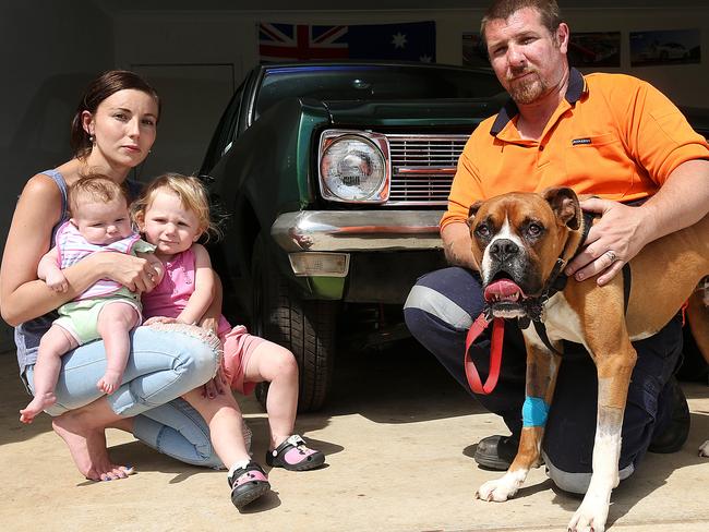 Leigh and Josephine Shaw with their daughters Lexie, 3mths and Carmen, 2. Mack the boxerwas lucky to survive the bite. Picture: Ian Currie