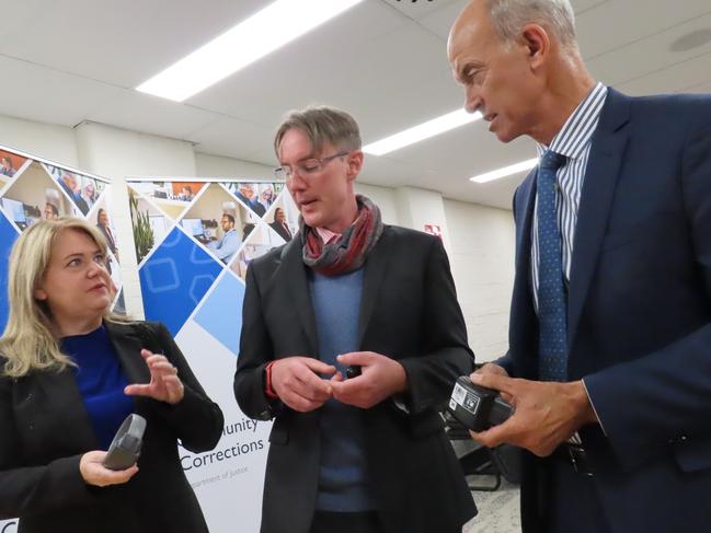 Minister for Corrections and Rehabilitation Madeleine Ogilvie, Community Corrections executive director Chris Carney and Attorney-General Guy Barnett inspect ankle bracelets at the Community Corrections Monitoring and Compliance Unit in Hobart on Thursday, February 6, 2025.