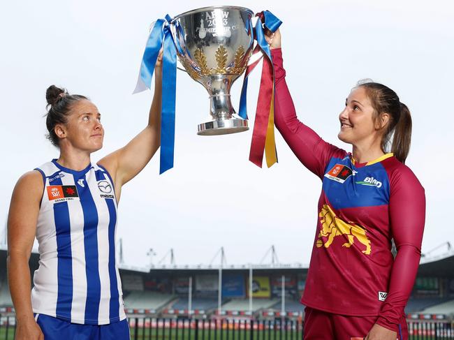 MELBOURNE, AUSTRALIA - DECEMBER 02: Emma Kearney of the Kangaroos and Breanna Koenen of the Lions pose with the 2023 AFLW Premiership Cup during the 2023 AFLW Grand Final Media Opportunity at Ikon Park on December 02, 2023 in Melbourne, Australia. (Photo by Michael Willson/AFL Photos via Getty Images)