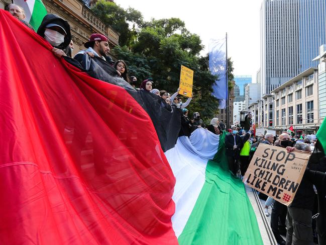 SYDNEY, AUSTRALIA - NewsWire Photos MAY 15, 2021: Members of the public gather at Sydney Town Hall to commemorate the catastrophic massacres of Palestinians in 1948 which caused the displacement and destruction of over 700,000 Palestinians who were uprooted from their homes and over 500 villages were eradicated. Today people gather around the world to protest, demanding Israel ends its ethnic cleansing of the Palestinian people, in Sydney, Australia. Picture: NCA NewsWire / Gaye Gerard