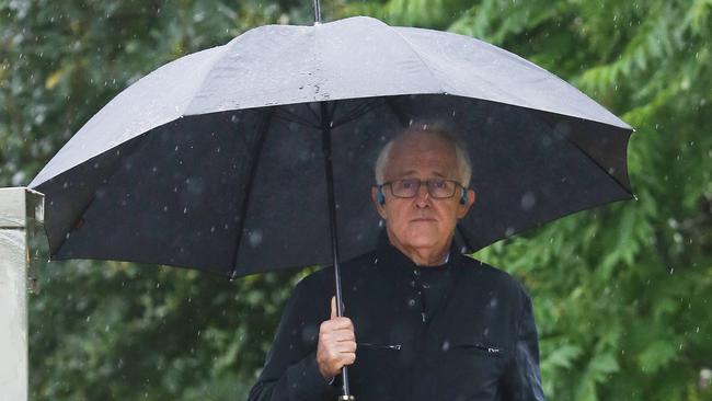 28/11/18: Former PM, Malcolm Turnbull walks in the rain near his home at Point Piper, Sydney. John Feder/The Australian.