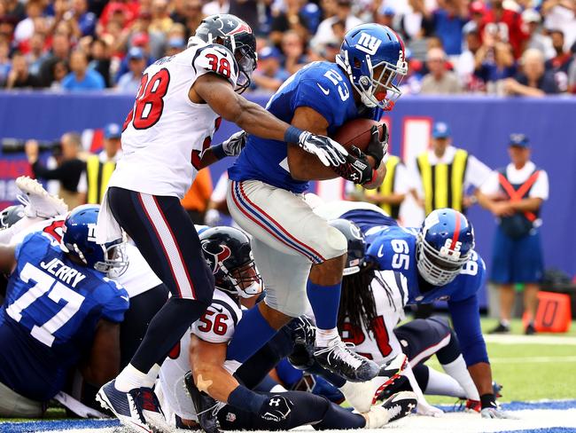 Rashad Jennings #23 of the New York Giants scores a touchdown in the second quarter against the Houston Texans.