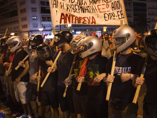 Anti-austerity protesters marched in front of the Greek parliament on Wednesday. Picture: Emilio Morenatti.