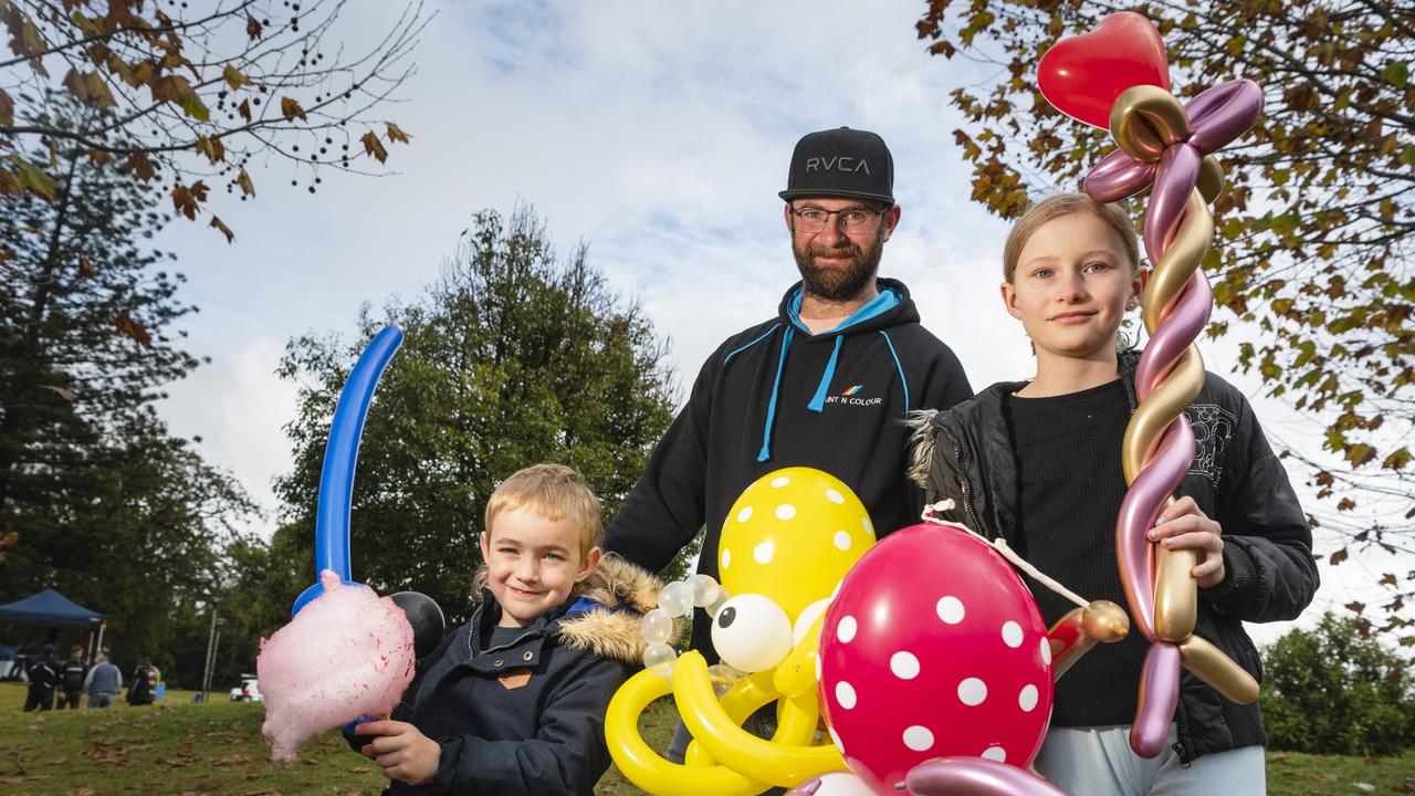 At Something About Bella – Bella's Birthday Fundraiser are (from left) Dexter Briese, Wade Briese and Emme Doidge with balloon creations, Sunday, June 4, 2023. Picture: Kevin Farmer