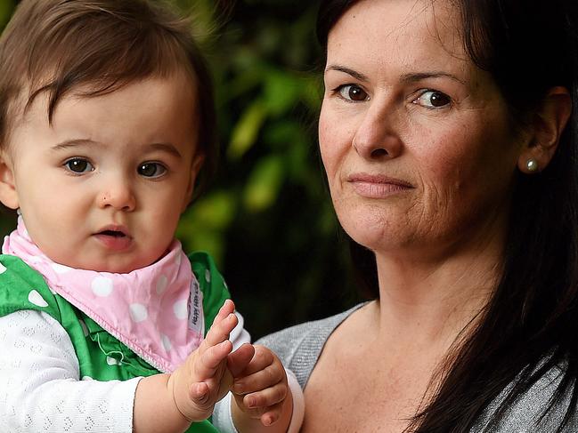 Sarah Swan holds her daughter Milicent (18months). Sarah paid Infant Massage Information Service $350 towards a $1300 course before finding out the business had faked much of its accreditation. Picture: Jake Nowakowski