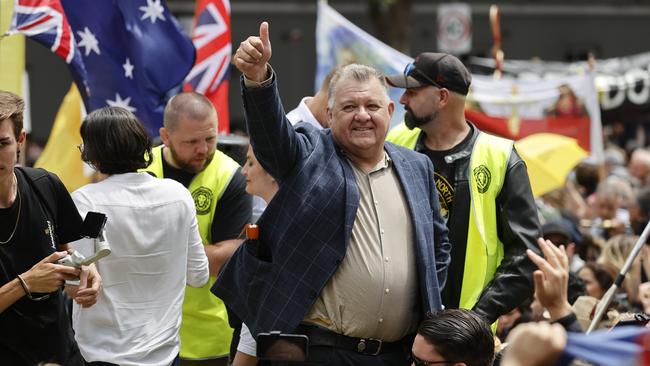 Former Liberal MP Craig Kelly walks through the crowd and speaks over the microphone at a Rise Up! Melbourne protest. Picture: Alex Coppel.