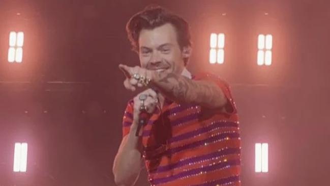 Styles dazzled the stage in pink pants and an orange and pink striped T-shirt.