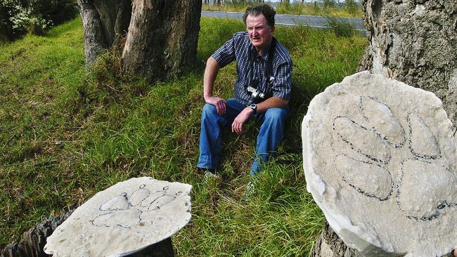 Cryptozoologist Rex Gilroy in Appin with paw print castings in 2007. Picture: Ian Svegovic