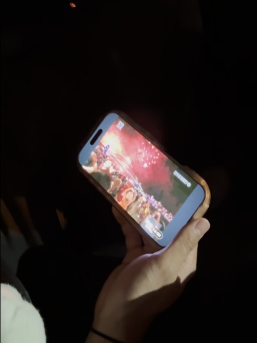 The pair ended up watching the fireworks on their phones in the backseat of their Uber, stuck in gridlock traffic (pictured). Image: Supplied