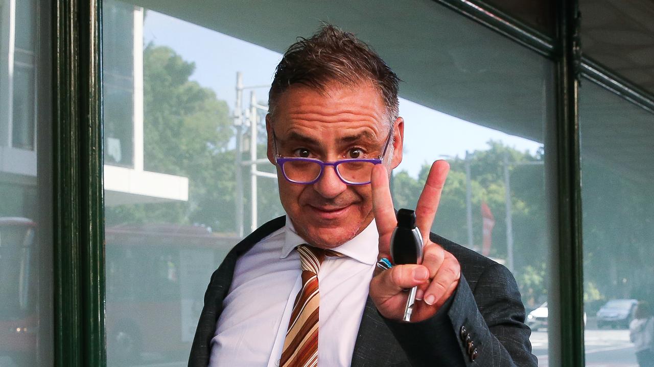 Andrew O’Keefe threw up a “v” for victory sign after charges against him were dropped. Picture: NCA Newswire / Gaye Gerard