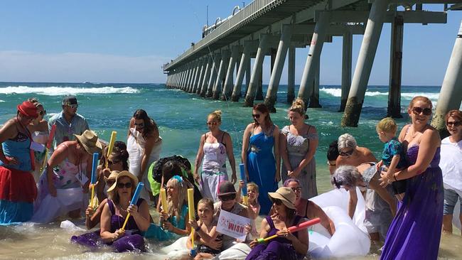 Friends of terminally-ill bride Joanne Colman, centre, donned their bridal gowns for a beach party with a difference. 