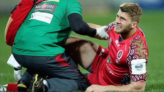 MELBOURNE, AUSTRALIA - JUNE 27: Dom Shipperley of the Reds is seen to by medical staff during the round 17 Super Rugby match between the Rebels and the Reds at AAMI Park on June 27, 2014 in Melbourne, Australia. (Photo by Robert Prezioso/Getty Images)