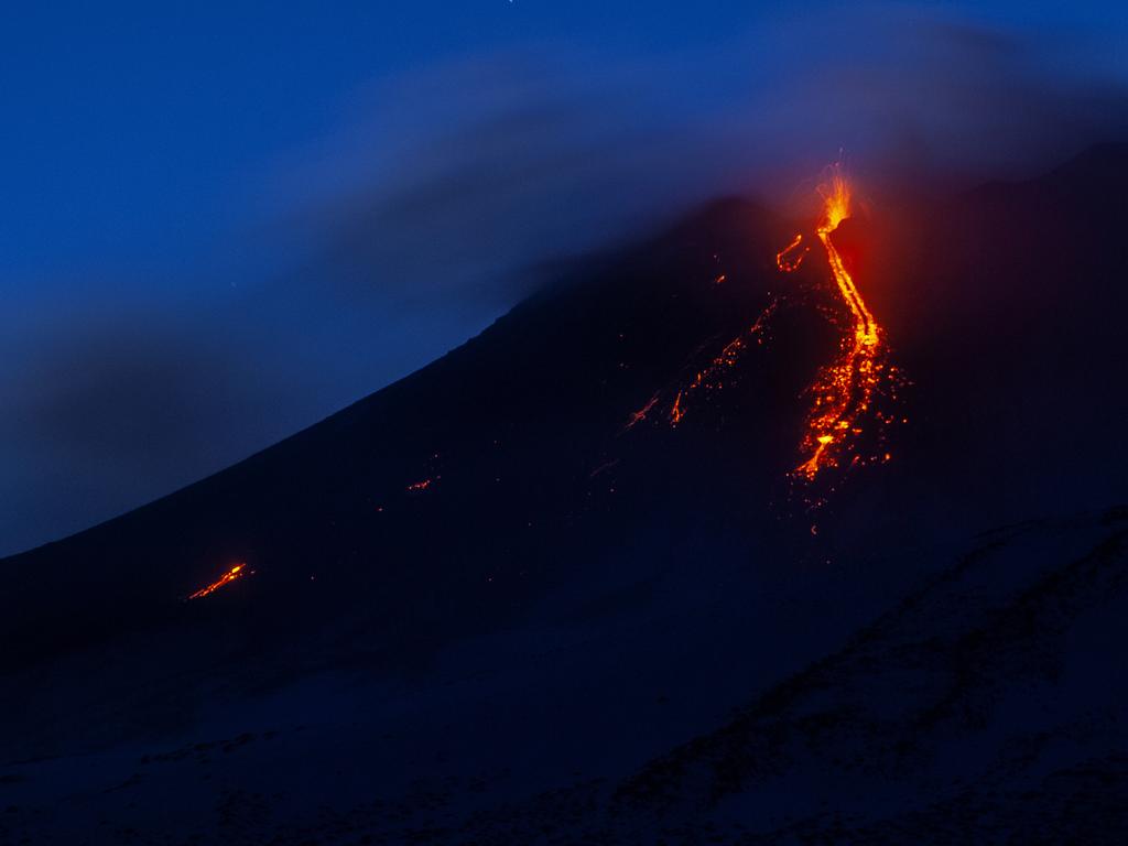 Mount Etna volcano spews lava during an eruption in early December. It has now started spewing ash and lava. Picture: AP Photo/Salvatore Allegra