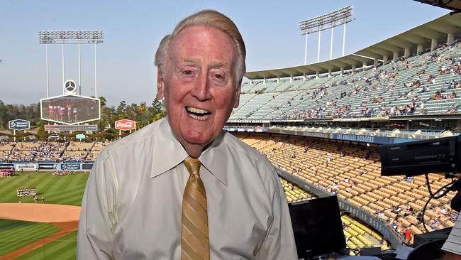 (FILES) In this file photo taken on July 30, 2016 Los Angeles Dodgers broadcaster Vin Scully in the booth before the game between the Los Angeles Dodgers and the Arizona Diamondbacks at Dodger Stadium in Los Angeles, California. - Former Los Angeles Dodgers broadcaster Vin Scully has died. He was 94. (Photo by Jayne Kamin-Oncea / GETTY IMAGES NORTH AMERICA / AFP)