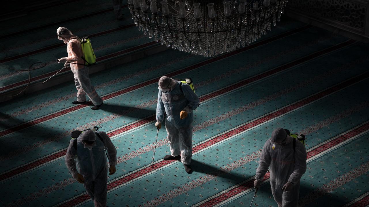 Workers from Istanbul Municipality disinfect a mosque to prevent the spread of the coronavirus ahead of Friday prayers on March 13, 2020 in Istanbul, Turkey. Picture: Chris McGrath/Getty Images