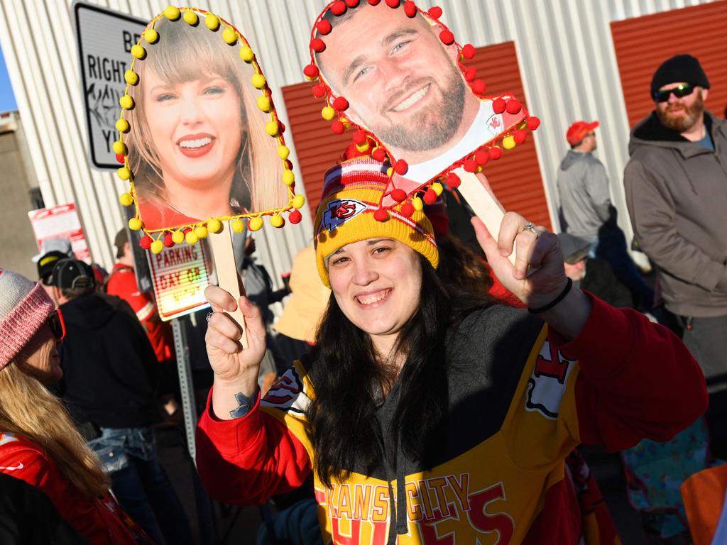 A fan holds up a sign of Taylor Swift and Travis Kelce #87 of the Kansas City Chiefs during the Kansas City Chiefs Super Bowl LVIII victory parade. Picture: Getty Images/AFP