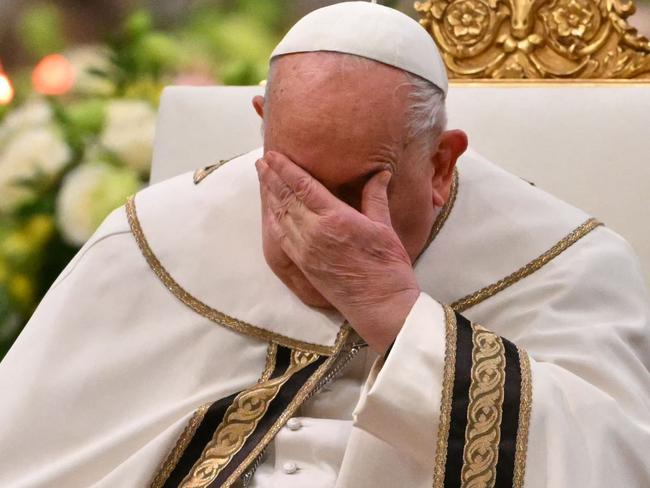 (FILES) Pope Francis gestures during the vespers at Saint Paul Outside the Walls, in Rome on January 25, 2025. Pope Francis was admitted to hospital in Rome on February 14, 2025 for tests and treatment for ongoing bronchitis, the Vatican announced. (Photo by Andreas SOLARO / AFP)