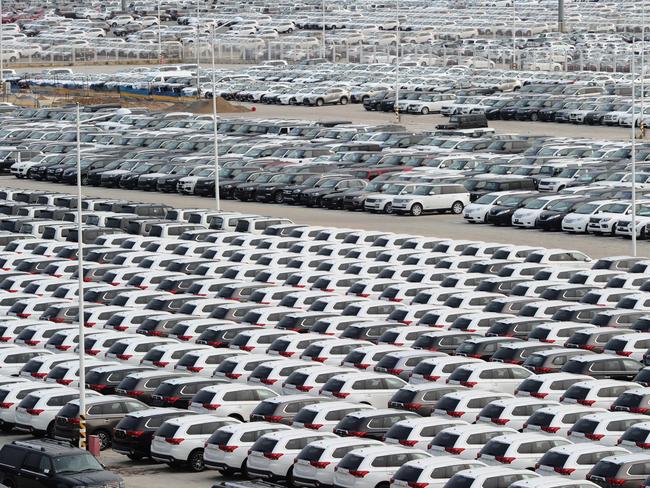 DALIAN, CHINA - OCTOBER 18: (CHINA OUT) Vehicles wait for shipment at Dalian port on October 18, 2015 in Dalian, China. China's economy expanded 6.9 percent year on year in the third quarter of 2015, slowing from 7 percent in the second quarter and 7 percent in the first, according to the National Bureau of Statistics on Monday. (Photo by VCG/VCG via Getty Images)