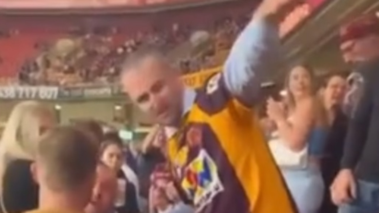 A crowd of Broncos and Bulldogs supporters tell Wade Ruben Hornery to leave after his disrespectful actions during the Anzac Day ceremony prior to the Brisbane Broncos/Canterbury Bankstown Bulldogs clash on April 22.