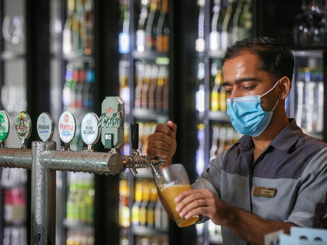 Silks Bar Tender Adesh pulling Pints Picture: Glenn Campbell