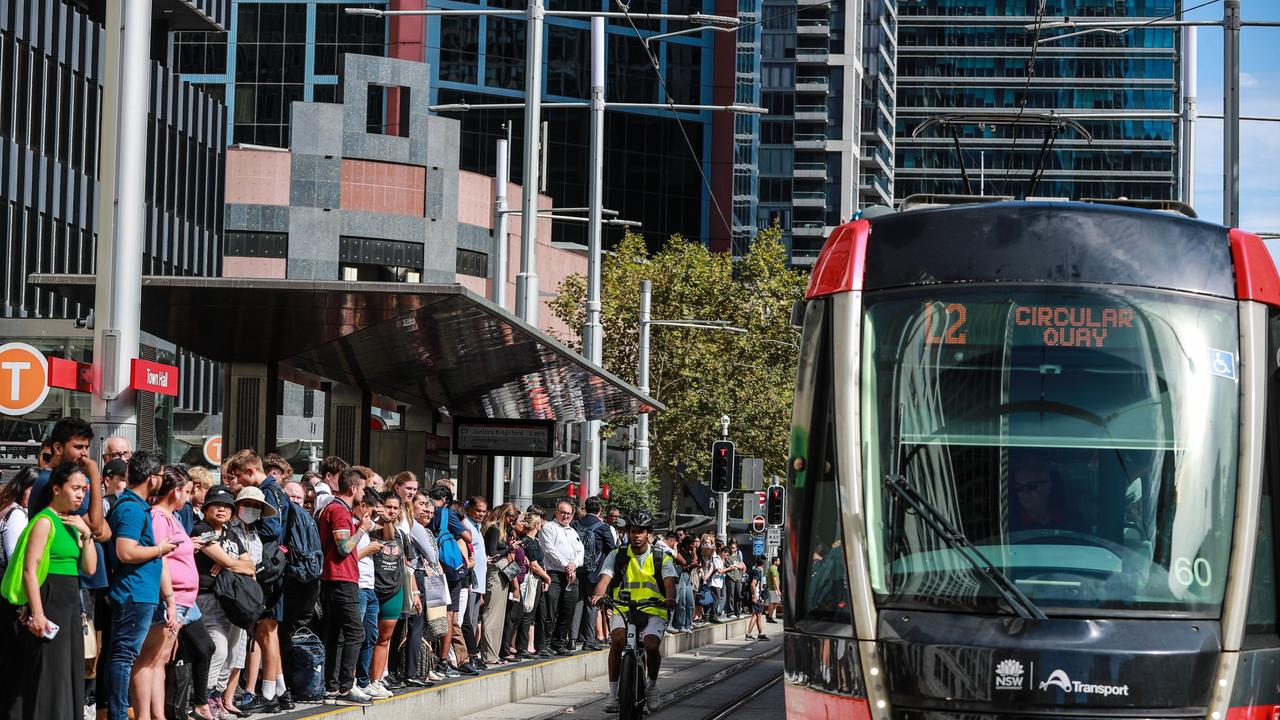 Commuters wait for light rail service at Town Hall Station. Picture: Roni Bintang