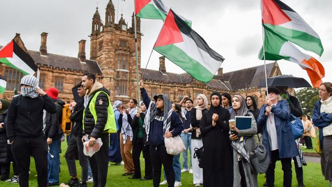 Members of the Australian Palestinian community shout slogans at the Palestinian Protest Campsite at University of Sydney.