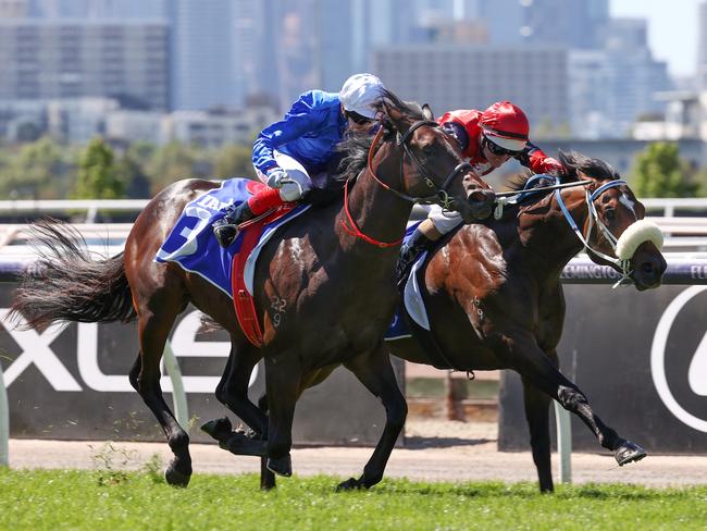 MELBOURNE. . Melbourne Cup Day. 02/11/2021.   Race 1. Darley Maribyrnong Plate.   Brereton ridden by Luke Nolen (red cap) wins in a photo from Renosu ridden by Craig Williams in the opening race  .  Photo by Michael Klein.