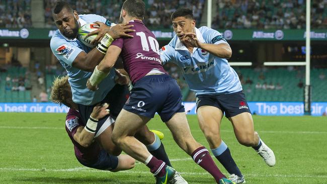 Taqele Naiyaravoro barges through to score for the Waratahs against the Reds at the SCG on Saturday night. Picture: AAP