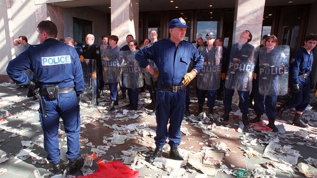 Riot police amid the damage at Parliament House after protesters stormed it in August 1996.