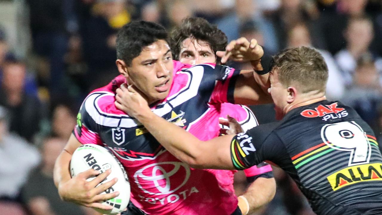 Jason Taumalolo of the Cowboys is tackled by Mitch Kenny of the Panthers