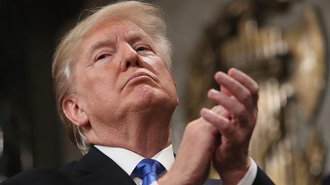 US President Donald J. Trump claps after the State of the Union address. AFP/Win McNamee