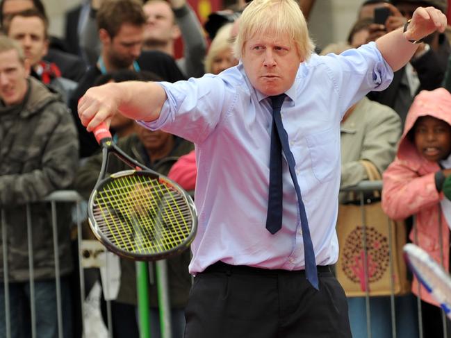 Former Mayor of London, Boris Johnson plays tennis during the International Paralympic Day in Trafalgar Square, central London, on September 8, 2011. Picture: AFP