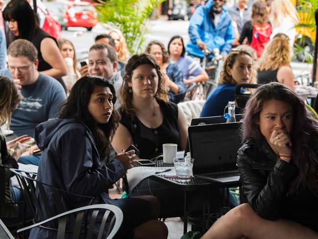 Spectatorsat Shaw's Tavern in northwest Washington, DC, watch as James Comey testifies before the Senate Intelligence Committee. Picture: AFP/Jim Watson