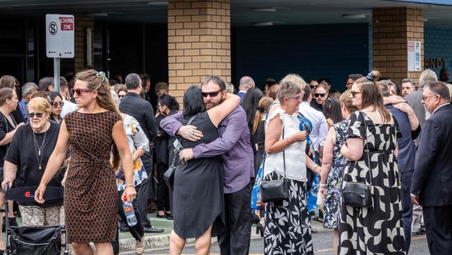 Dr Gordon’s family and friends embraced after the service. Picture: NCA NewsWire / Jake Nowakowski