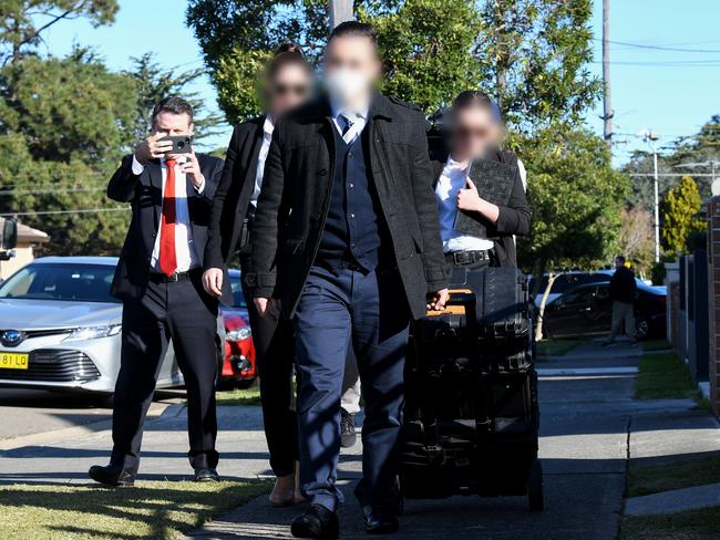 Federal agents are seen leaving the home of NSW Labor MP Shaoquett Moselmane in Rockdale, Sydney, today. Picture: AAP