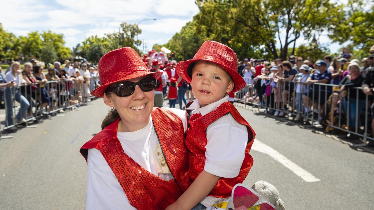 Krystal and Thatcher Ward-Pearson walking with the Heritage Bank float Grand Central Floral Parade of Carnival of Flowers 2022, Saturday, September 17, 2022. Picture: Kevin Farmer