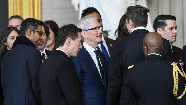 Google boss Sundar Pichai, TikTok’s Shou Chew, Apple chief Tim Cook, and Tesla and SpaceX CEO Elon Musk mingle at the US presidency inauguration. Picture: AFP