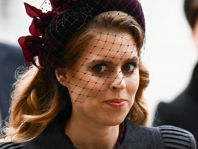 Britain's Princess Beatrice of York (L) and her sister Britain's Princess Eugenie of York arrive to attend a Service of Thanksgiving for Britain's Prince Philip, Duke of Edinburgh, at Westminster Abbey in central London on March 29, 2022. - A thanksgiving service will take place on Tuesday for Queen Elizabeth II's late husband, Prince Philip, nearly a year after his death and funeral held under coronavirus restrictions. Philip, who was married to the queen for 73 years, died on April 9 last year aged 99, following a month-long stay in hospital with a heart complaint. (Photo by Daniel LEAL / AFP)