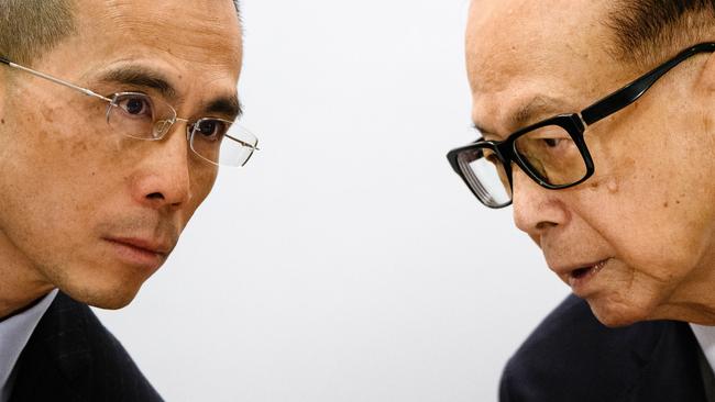 CKI chairman Victor Li with his father Li Ka-shing. Picture AFP