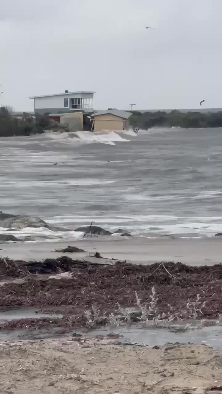 Shack taken by massive ocean swell