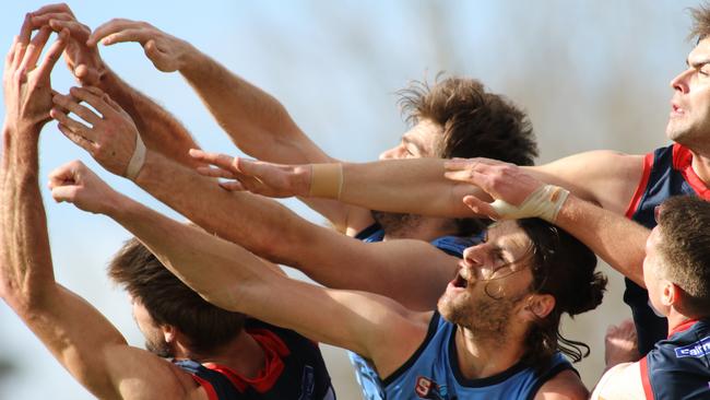 Sturt's Joshua Patullo spoils Norwood’s Brady Dawe at Unley Oval. Picture: AAP IMAGE/ Russell Millard