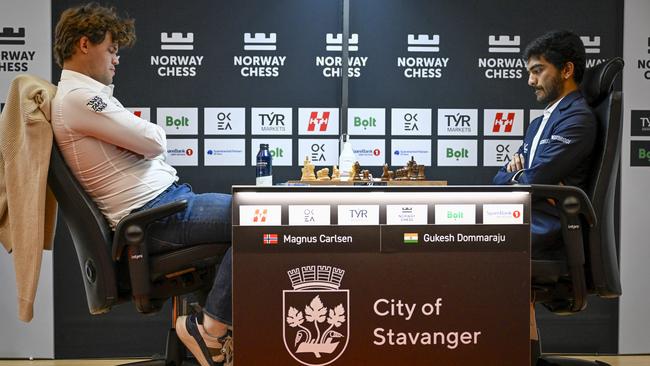 Magnus Carlsen from Norway, left, and Gukesh Dommaraju from India during the first game of Norway Chess in Finansparken in Stavanger, Norway. Picture: Carina Johansen/NTB via AP