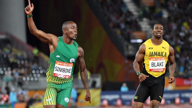 South Africa’s Akani Simbine celebrates winning gold in the 100m final. Jamaica’s Yohan Blake was third.