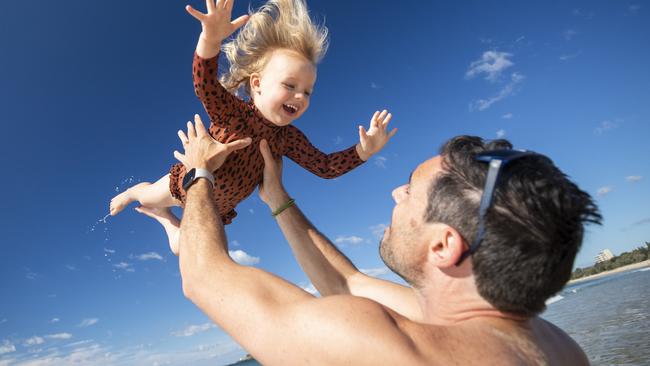 Two-year-old Elodie Spencer flies with her dad Jansen at Mooloolaba ahead of Queensland Day on June 6. Picture: Lachie Millard