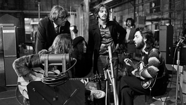 John Lennon, Mal Evans (Road Manager), Yoko Ono Lennon, Ringo Starr and Paul McCartney at Twickenham Film Studios, in The Beatles: Get Back. Imgae: Ethan A. Russell / © Apple Corps Ltd.