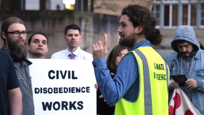 Extinction Rebellion activists gather in Brisbane CBD on June 17. Picture: AAP/Dave Hunt