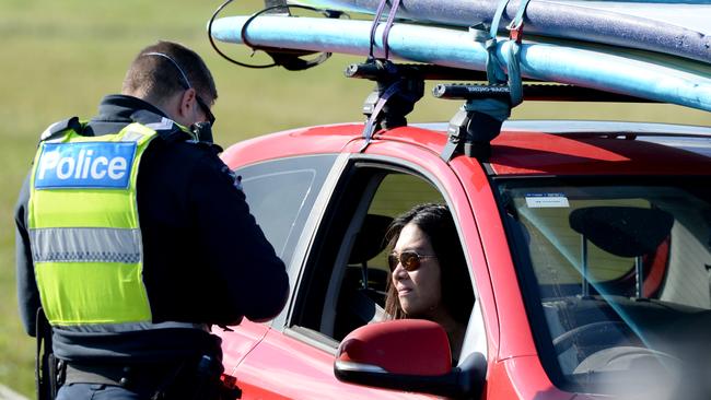 Police pull over motorists not complying with lockdown. Picture: Andrew Henshaw