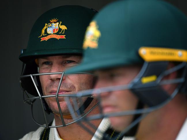 David Warner (L) and Marcus Harris prepare to walk out to bat during the last Ashes tour of England, in 2019. Picture: Paul Ellis/AFP